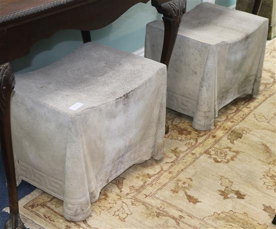 A pair of reconstituted marble seats W.58cm